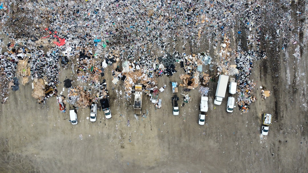 Aerial view of waste and garbage being unloaded from vehicles at a landfill in Calgary, Alberta, Canada
